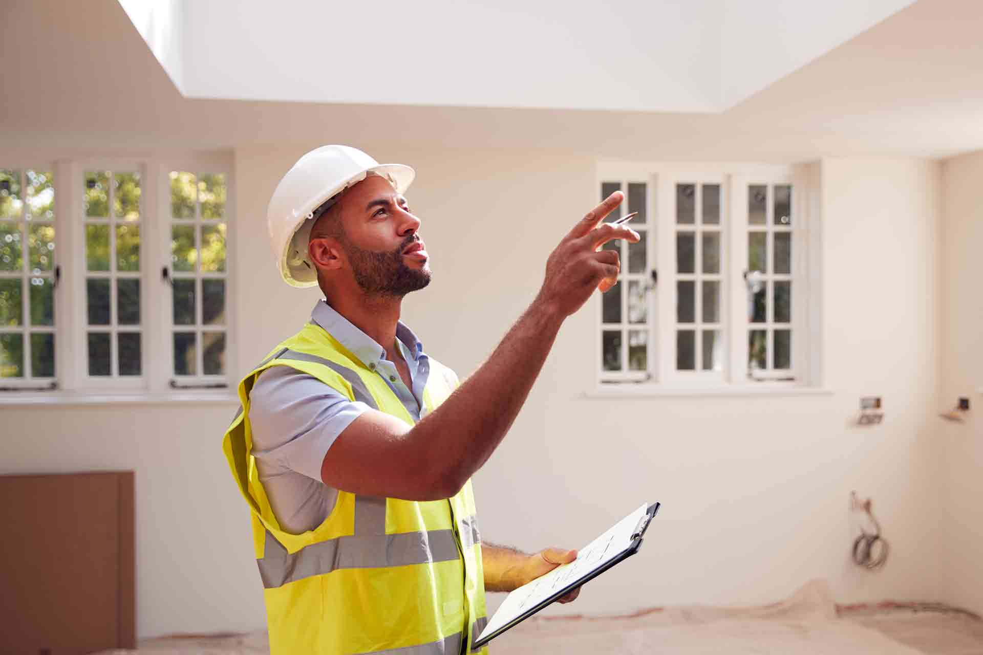 Third Party Wall Surveyors Newcastle upon Tyne reviewing plans between two parties during a dispute